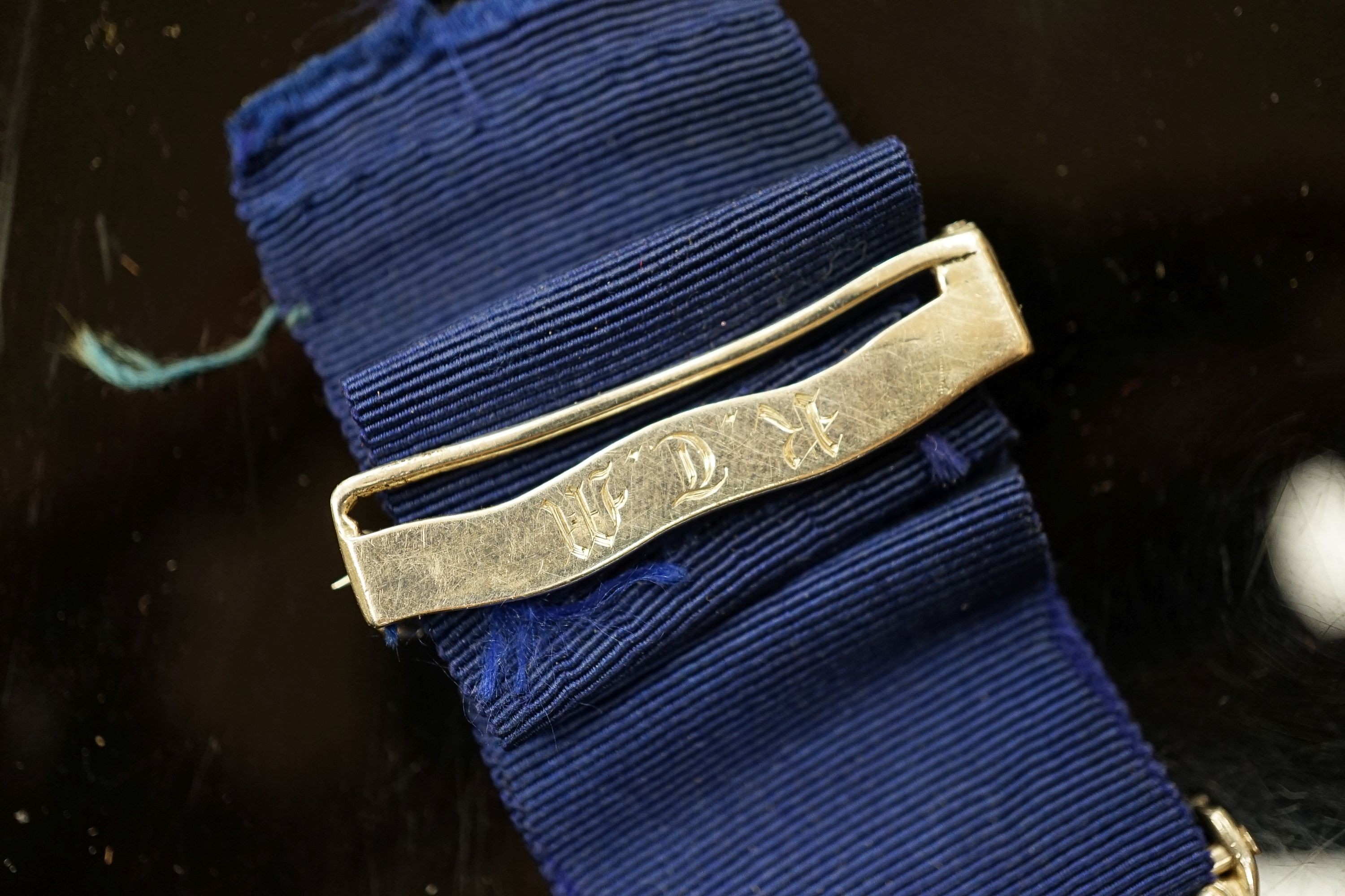 A Royal Humane Society small silver medal, the clasp initialled R.T.M.